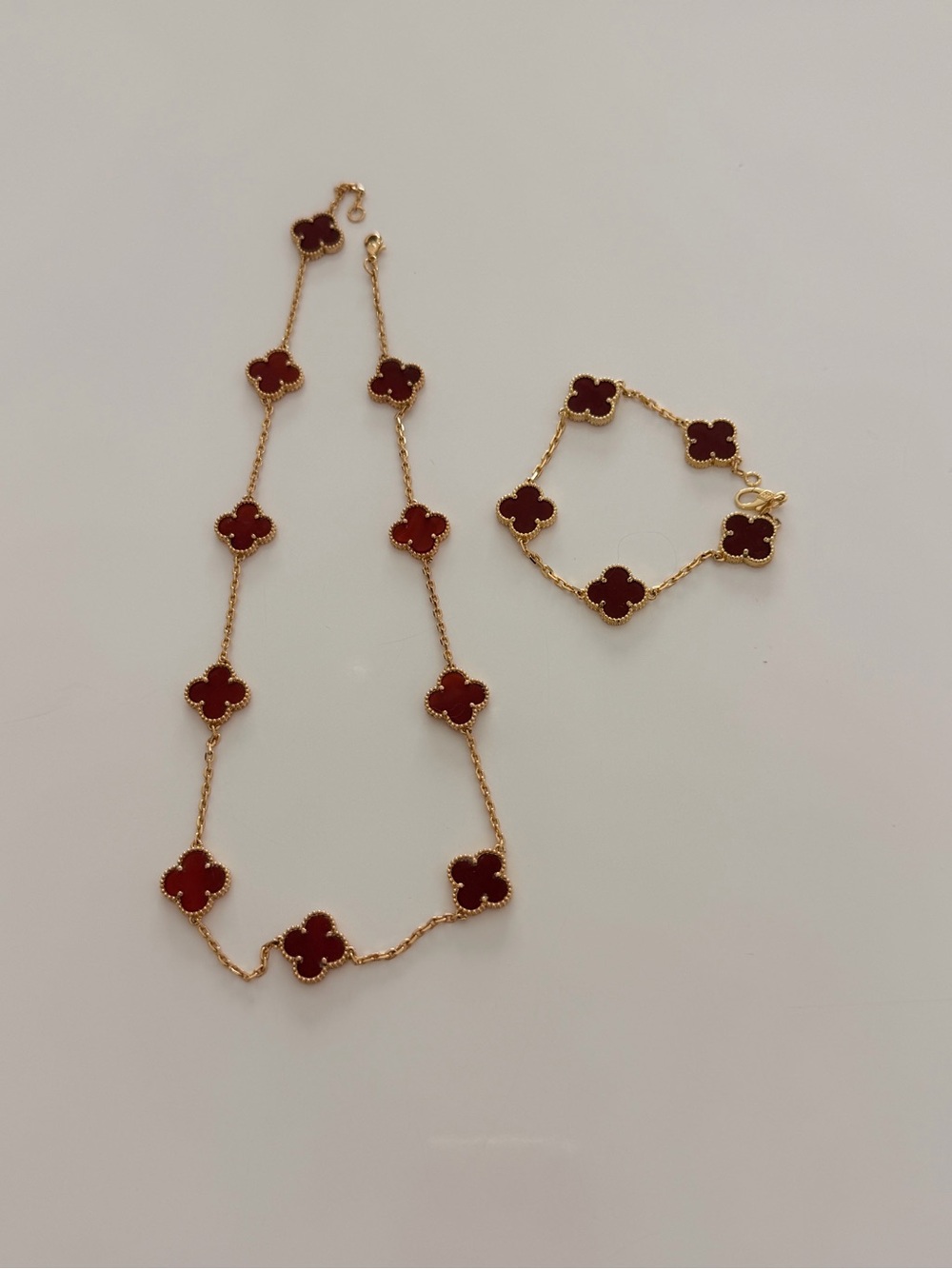 Van Cleef & Arpels Gold Necklace and Bracelet with Red Clover Motifs